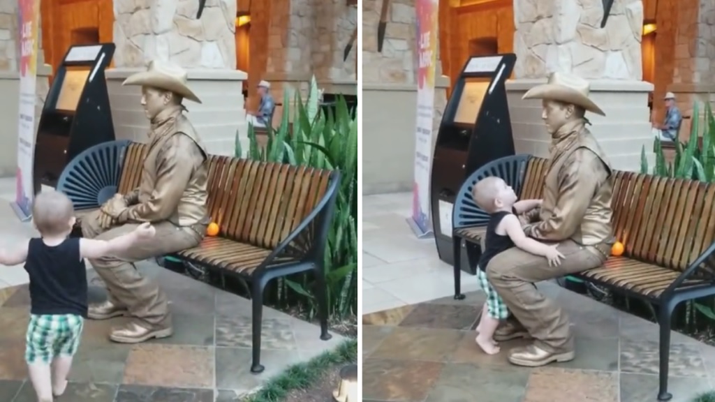 Stoic “Statue” Can’t Help But Break Character When Toddler Comes In For A Hug